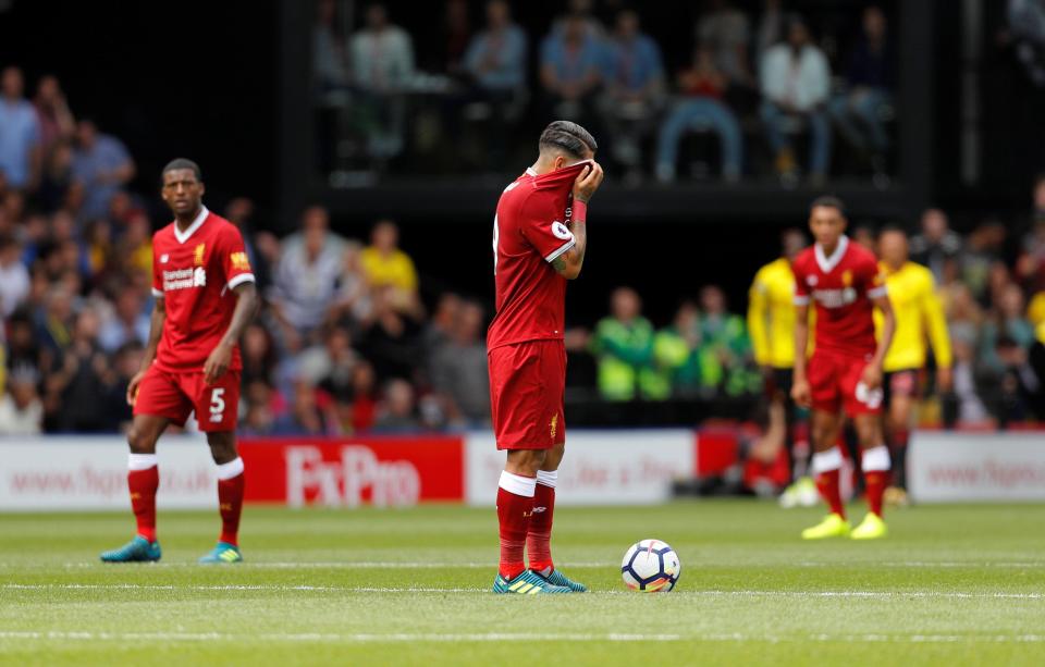  Liverpool players react after conceding yet another soft goal