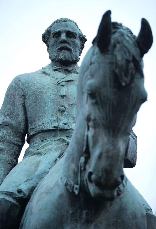  The statue of Confederate General Robert E. Lee stands in the centre of Emancipation Park the day after the Unite the Right rally