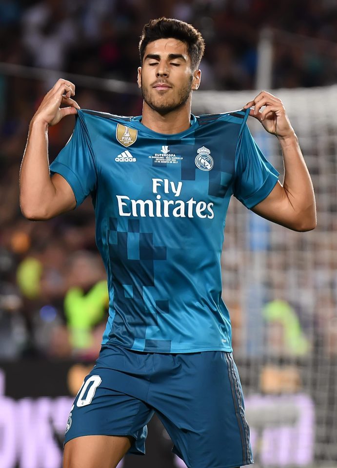  Marco Asensio celebrates netting Real's third goal against Barcelona on Sunday