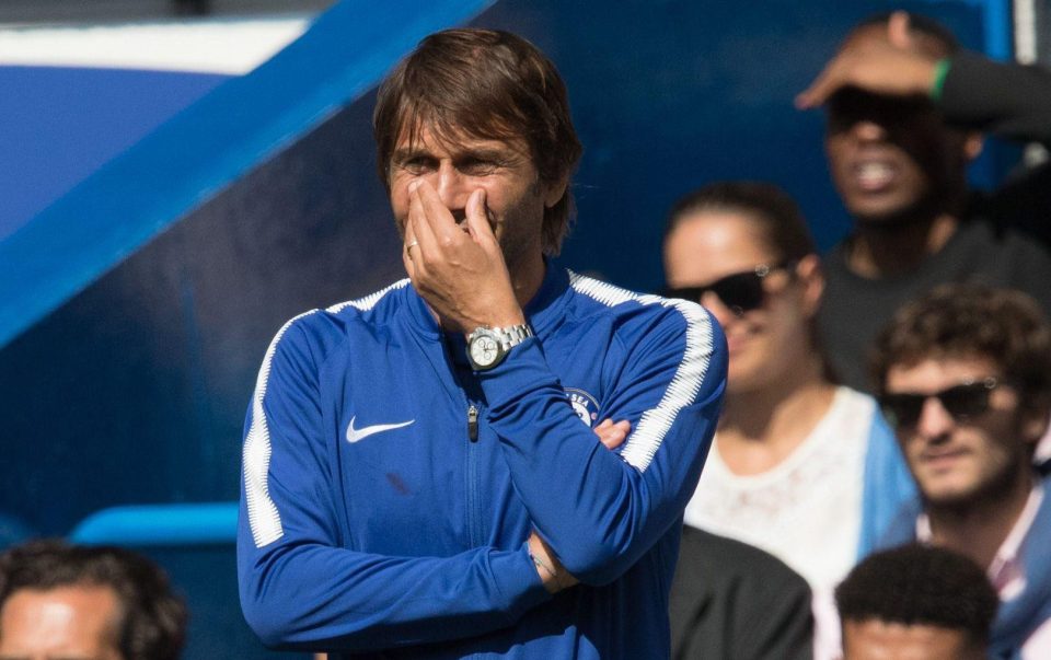 A concerned Antonio Conte watches Chelsea's defeat to Burnley