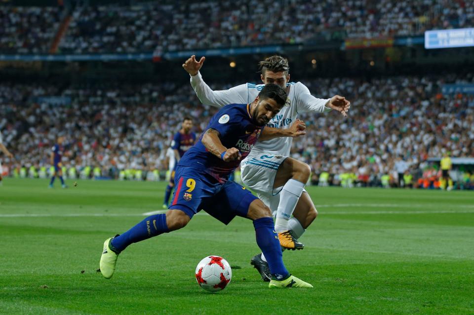  Mateo Kovacic keeps Luis Suarez close during Super Cup clash at Bernabeu