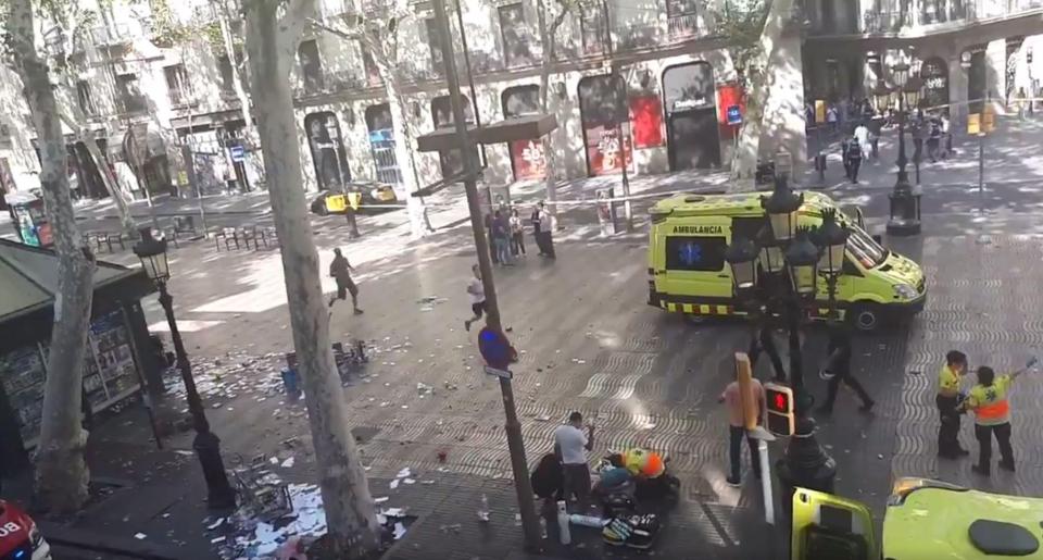  First responders rush to help the injured in the Barcelona terror attack