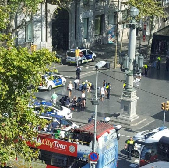  Spanish police officers cordon off Las Ramblas as emergency services tend to the injured