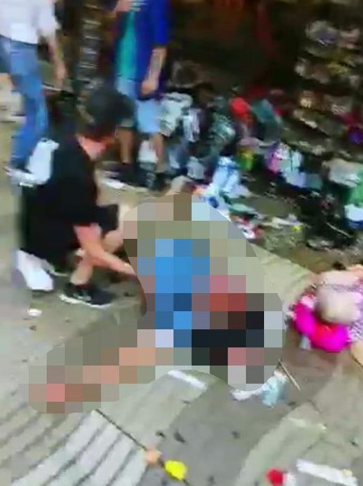  A victim pictured lying on the ground following the deadly rampage