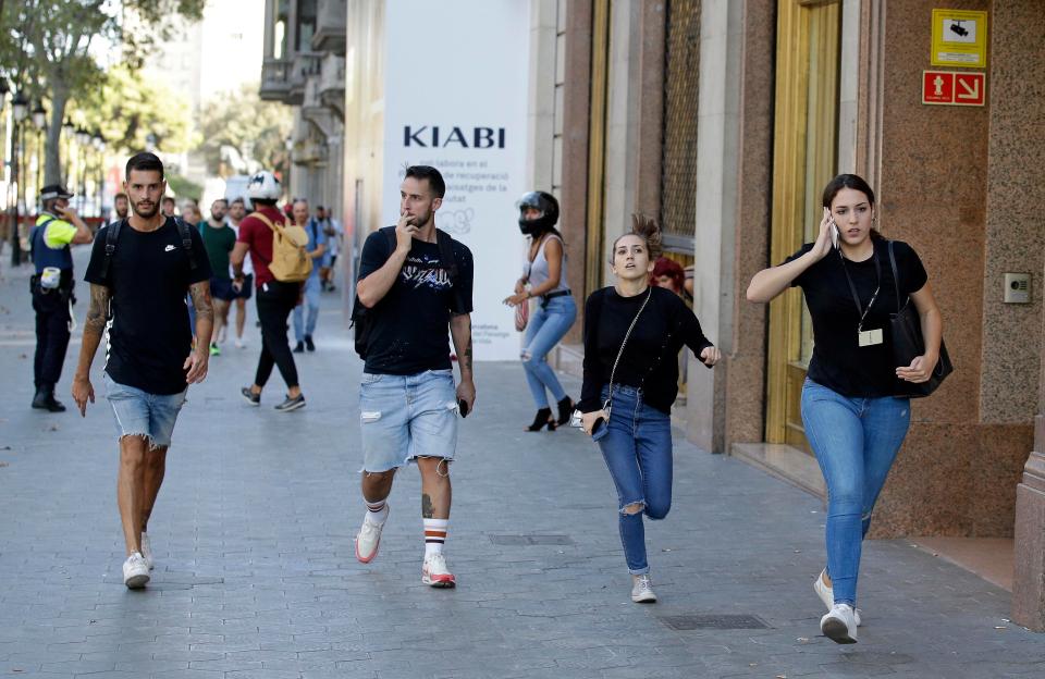  Young people run down the street amid the chaos of the depraved van assault