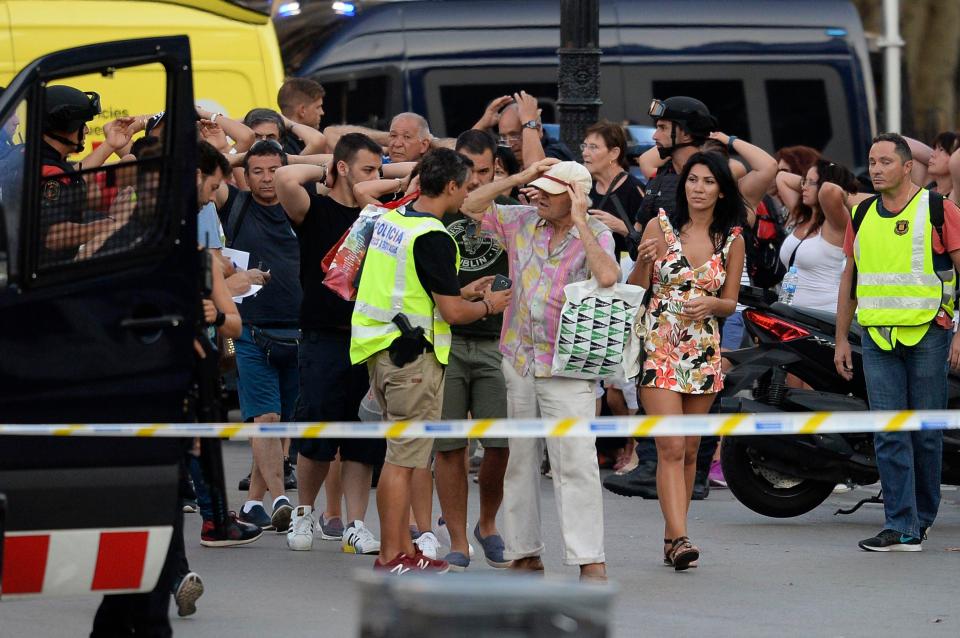  Terrified people being evacuated from the busy tourist hotspot in Barcelona