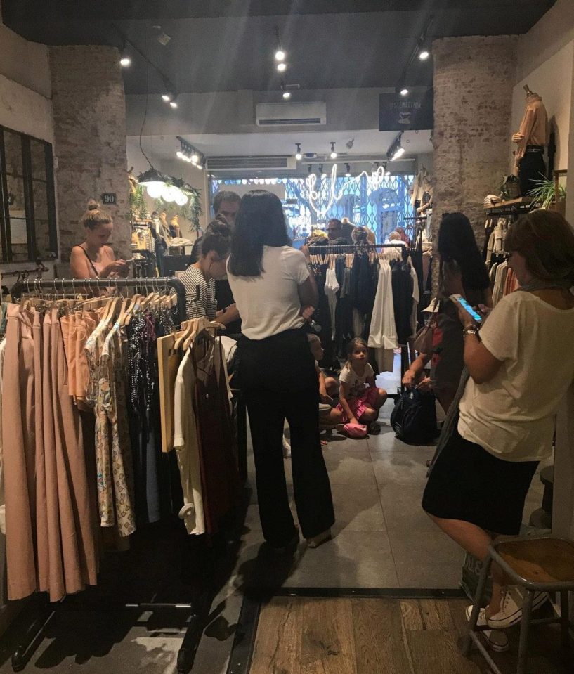  People pictured hiding in shops during the police operation in Barcelona