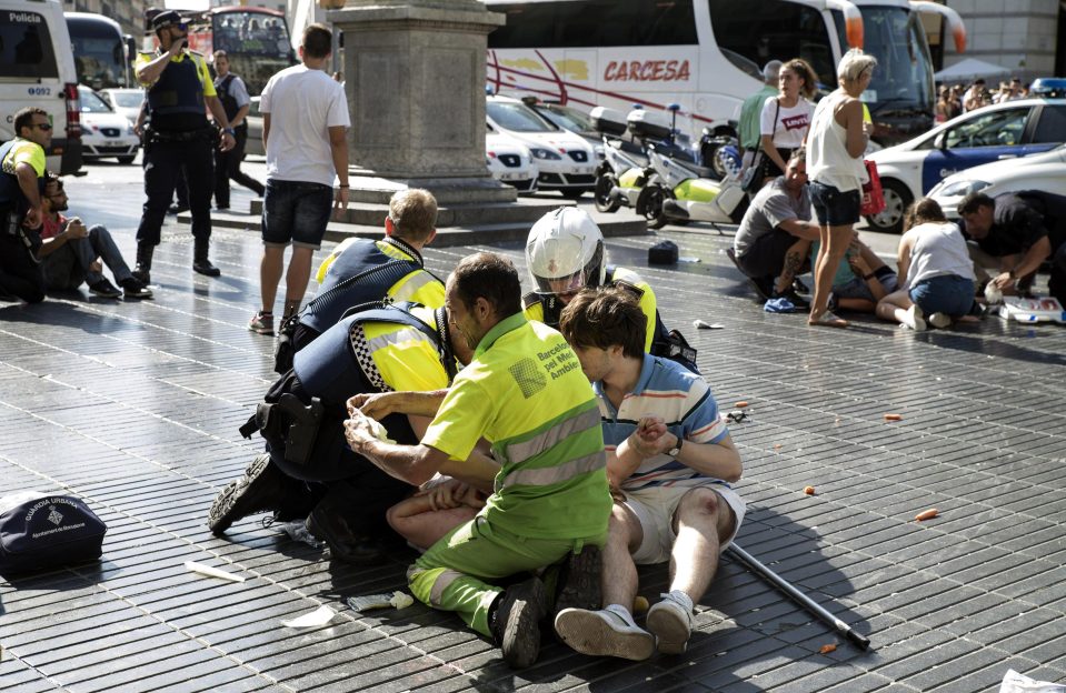  Injured victims being treated on the ground in Las Ramblas