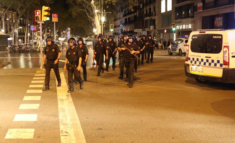  Dozens of armed cops pictured patrolling the Catalan city