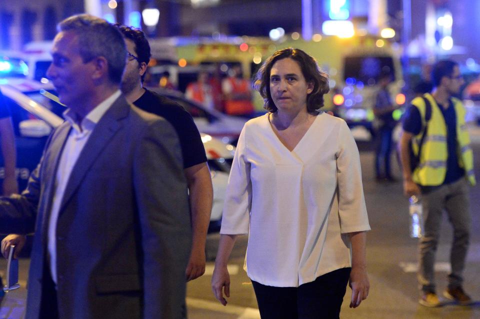  Barcelona's Mayor Ada Colau and officials arrive in the Las Ramblas area following the deadly attack