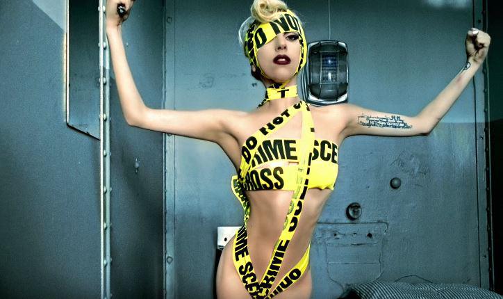 Gaga covered herself up in a yellow and black police crime scene tape for the telephone video