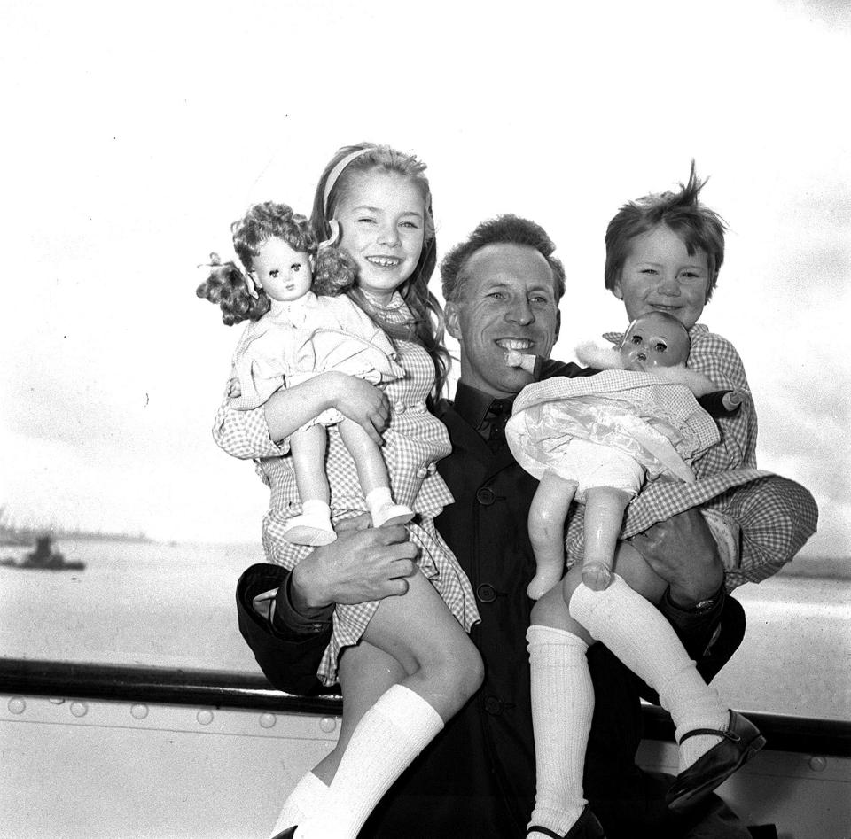  Bruce sails for a sunshine holiday to South Africa on the liner Penndenis Castle with his first wife Penny Calvert and two daughters Debbie age 6 and Julie age 4