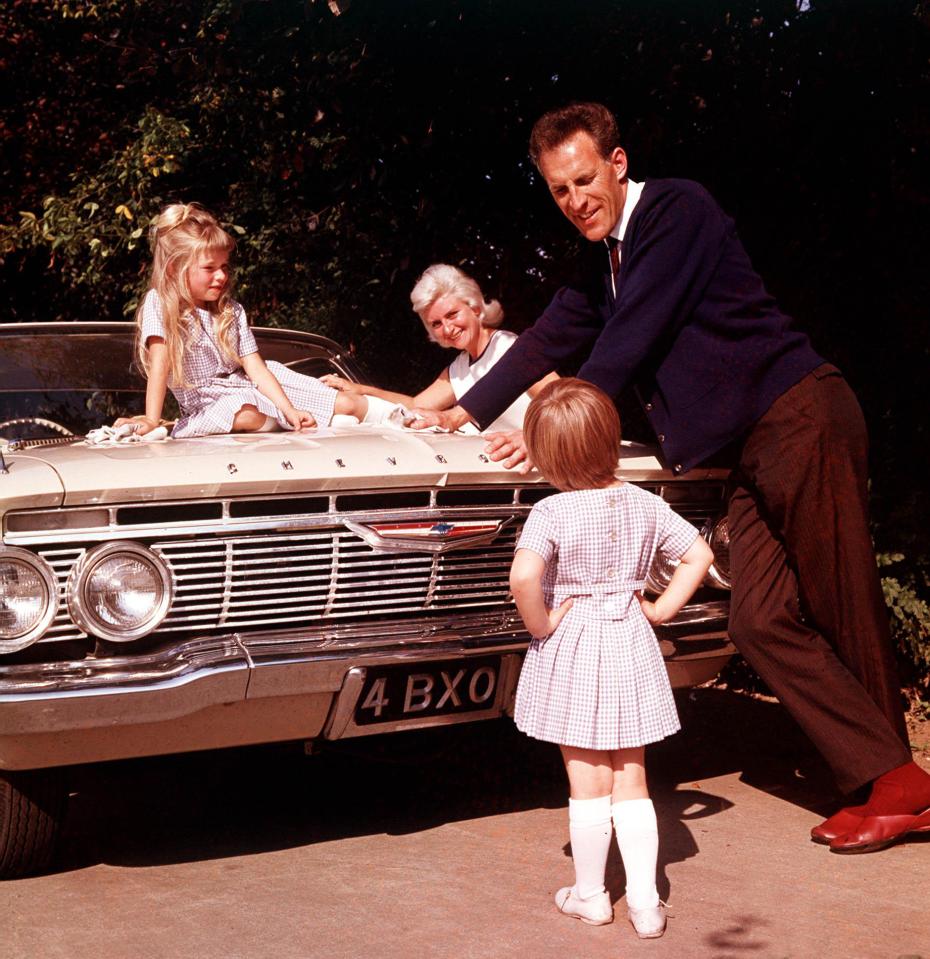  Off duty . . . relaxing at home in 1961 with his family