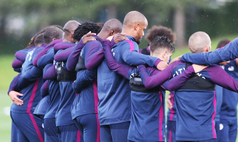 Manchester City players pay tribute to the Barcelona victims in training on Friday