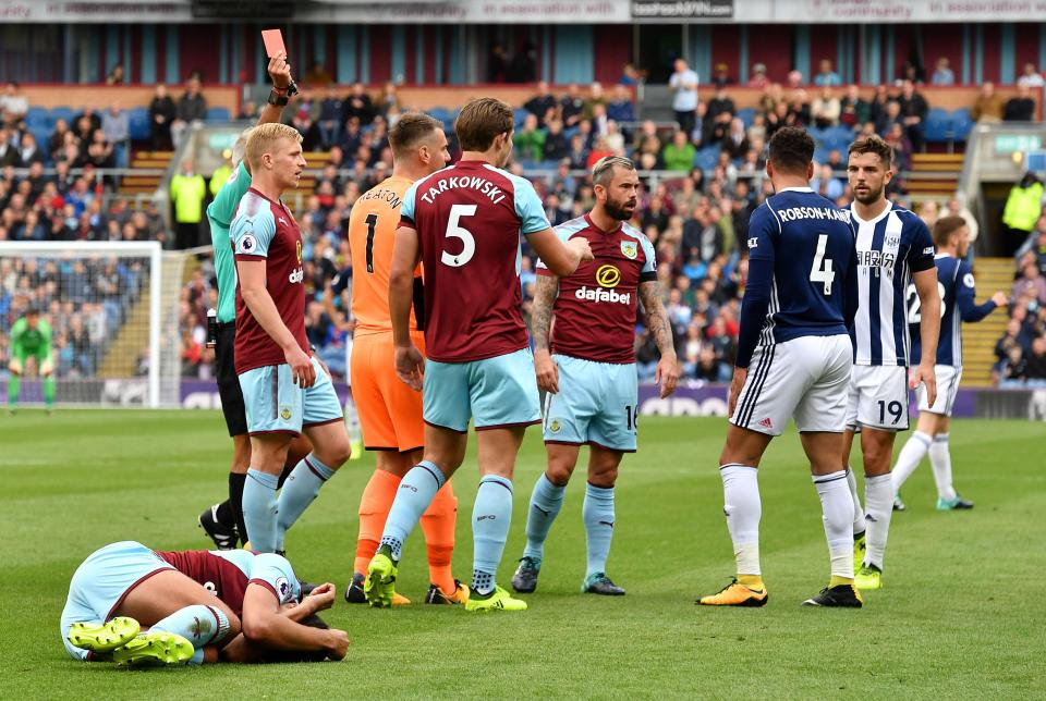  Matt Lowton lies on the ground as Robson-Kanu sees red