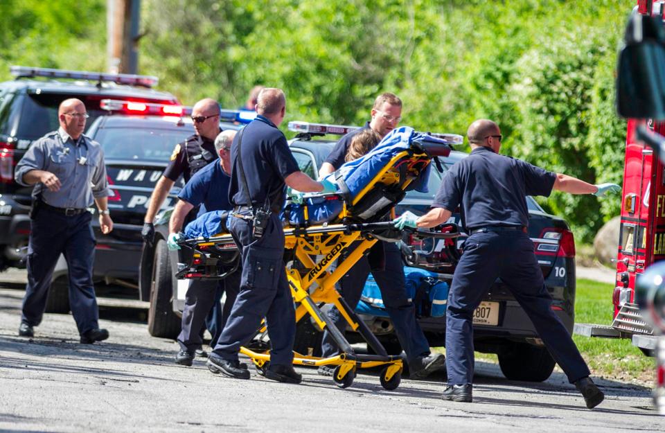  Leutner was found by a cyclist when the girl was "the width of a human hair" away from death, according to doctors (pictured being rescued by paramedics)