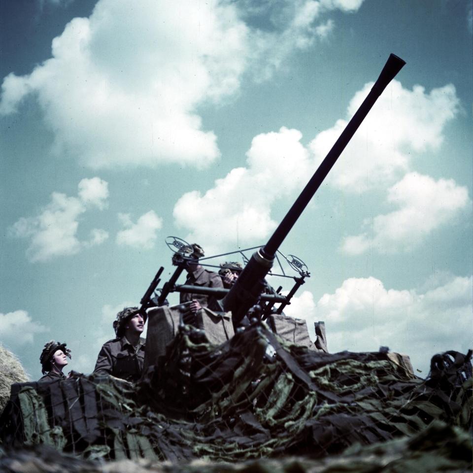  Canadian troops target enemy aircraft with a 40mm Bofors cannon