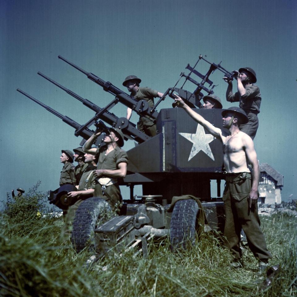  American troops man a 20mm gun on raised ground above Juno beach