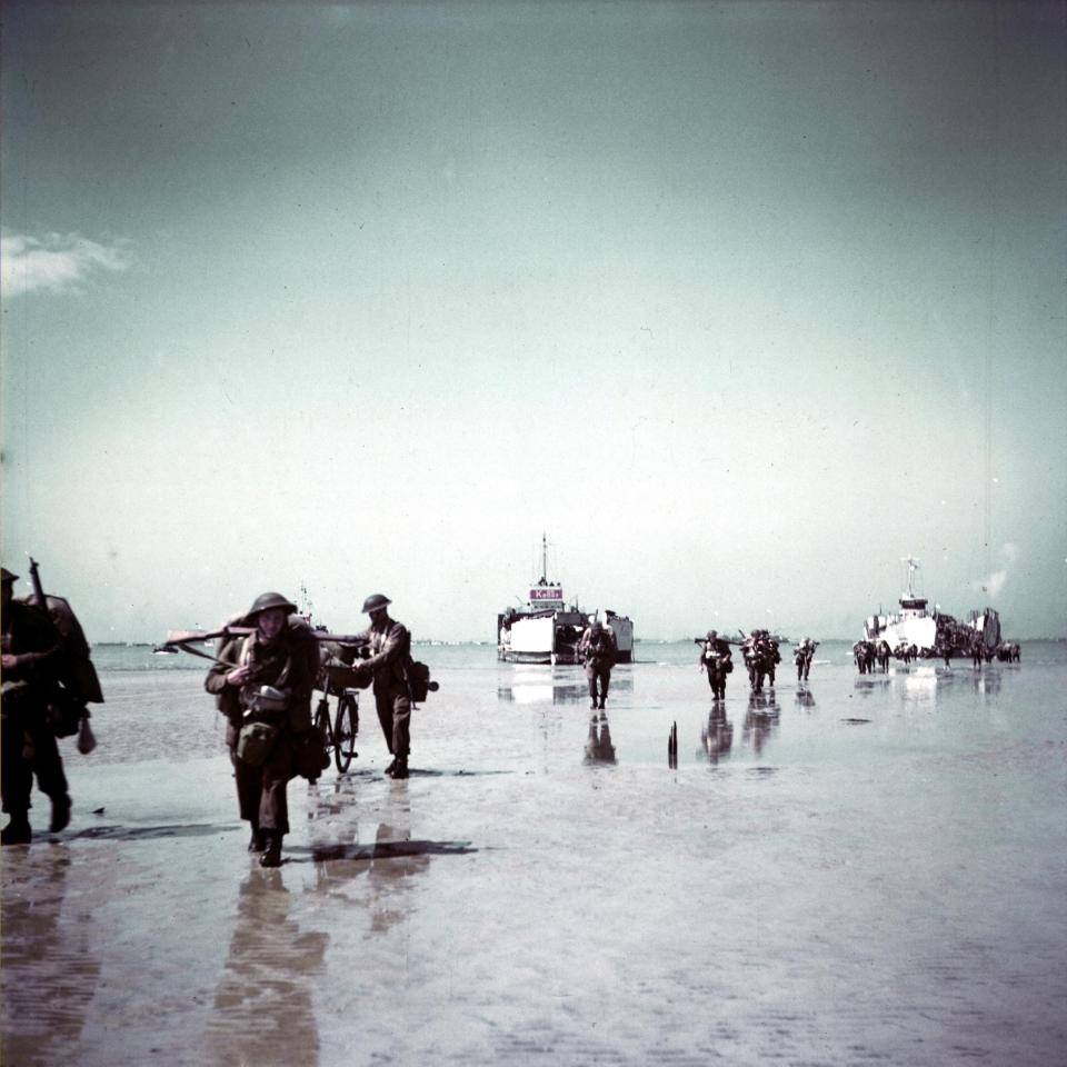  These Canadian troops arrive on the wide, flat sands of Juno beach before pushing further into Normandy