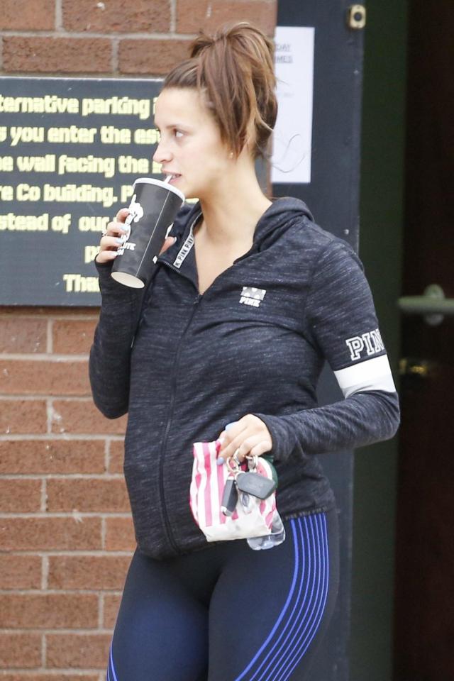  Ferne showed off her baby bump in a tight hoodie and blue leggings