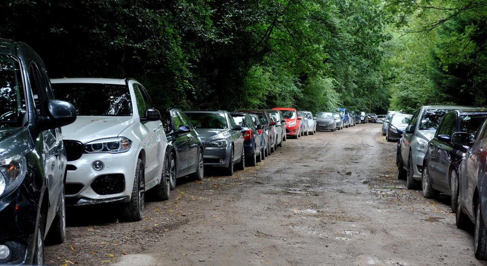  Bosses at the firm in Altrincham believe a criminal gang is behind the spate of thefts. Pictured: The 'overfill' parking on the dirt track leading to the main car park