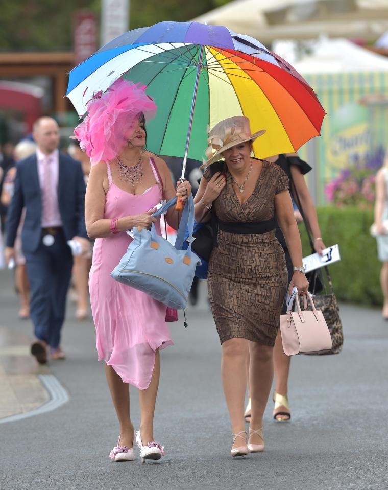  Bright, colourful umbrellas were the number one accessory at York Ladies Day this year