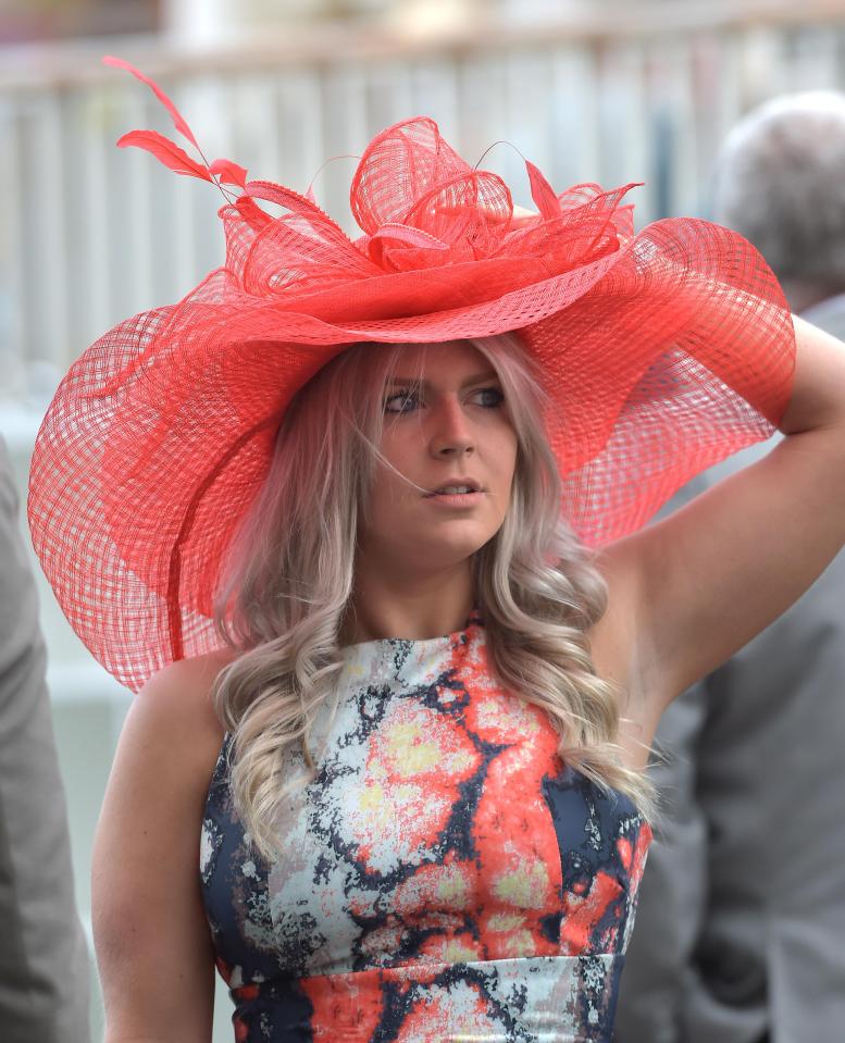  Glam York racegoers were seen holding onto their elaborate hats today as they got caught in blustery winds