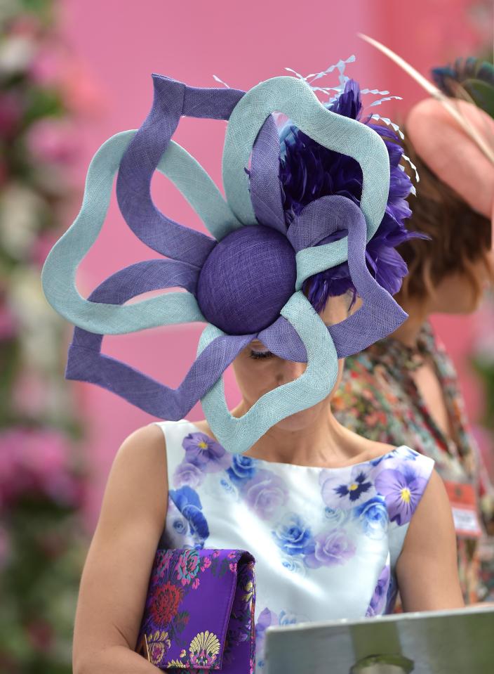  A glam racegoer turned heads in a giant purple and light blue floral hat