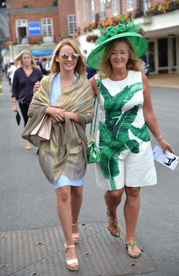  The gates opened at 11.15am, and it was clear many were in the party spirit. One woman shielded from the wind with a gold scarf