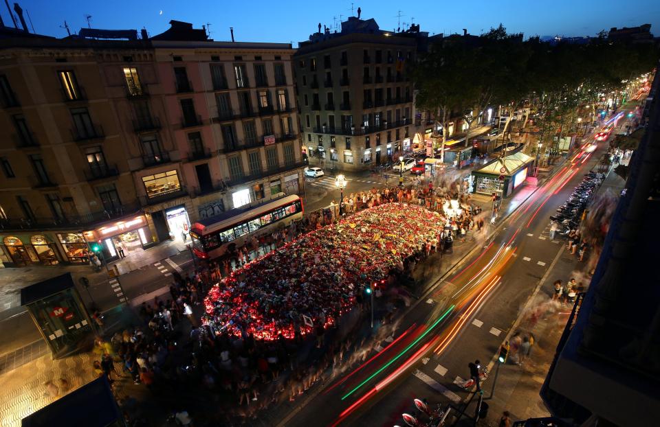  People gathered at an impromptu memorial where the van crashed into pedestrians in Barcelona, Spain