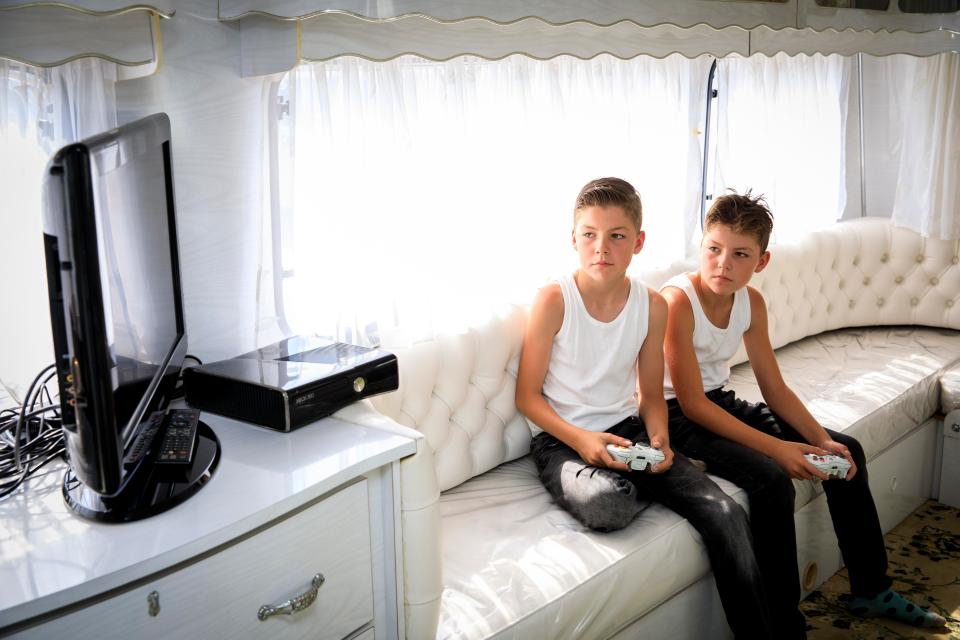  A brand new X-box sits among the traditional crockery in the trailers of modern Gypsies