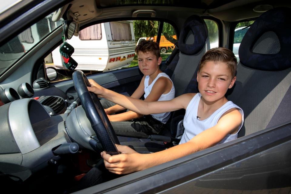  Abraham at the wheel of the twins' car, which they can drive on the private roads and in the fields