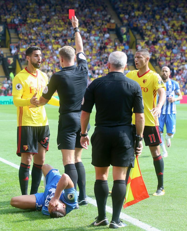  Watford's Miguel Britos receives a red card for serious foul play