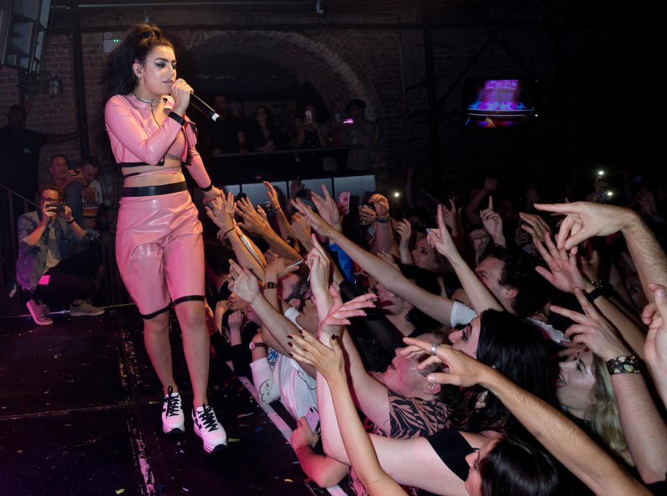  Charli XCX struts her stuff for fans