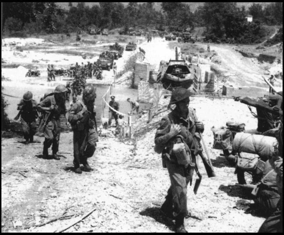  After the fall of the Gustav Line, British tanks of the 78th Infantry Division cross a pontoon bridge in Liri valley