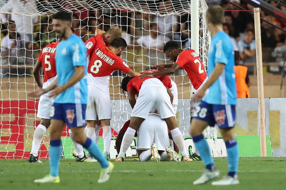  Djibril Sidibe is on floor after diving header with Monaco players around him