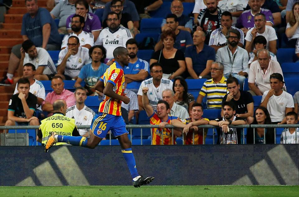  Geoffrey Kondogbia wheels away in delight after putting Valencia in front against the La Liga champions