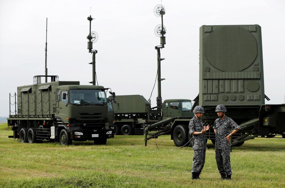  Japan Self-Defence Forces (JSDF) soldiers take part in a drill to mobilise their Patriot Advanced Capability-3 (PAC-3) missile unit