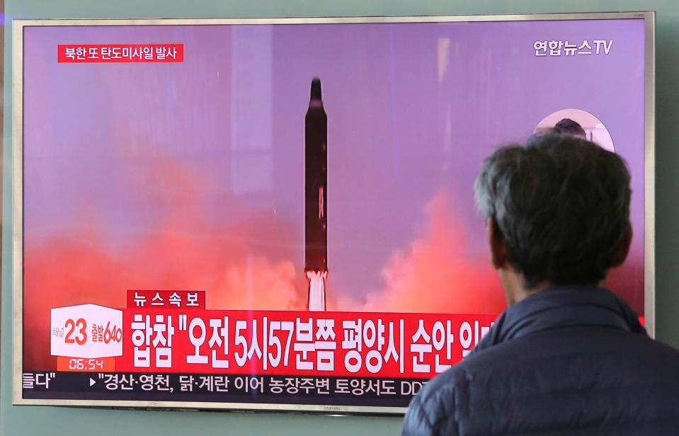  North Korea fired a ballistic missile from its capital Pyongyang that flew over Japan before plunging into the northern Pacific Ocean, officials said