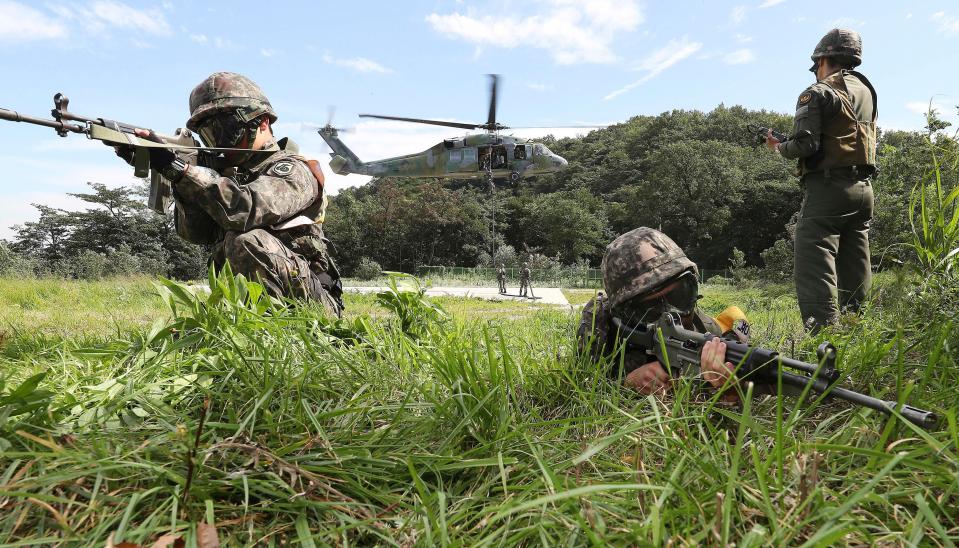  South Korean soldiers carry out an army exercise today as tensions in the region mount