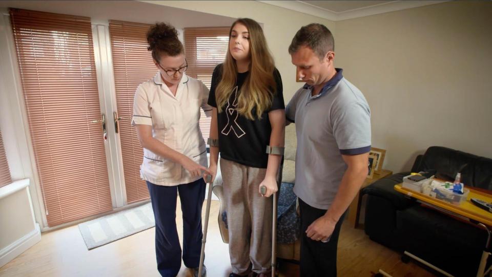  The teenager was filmed as she took her first steps on crutches seven weeks after leaving hospital