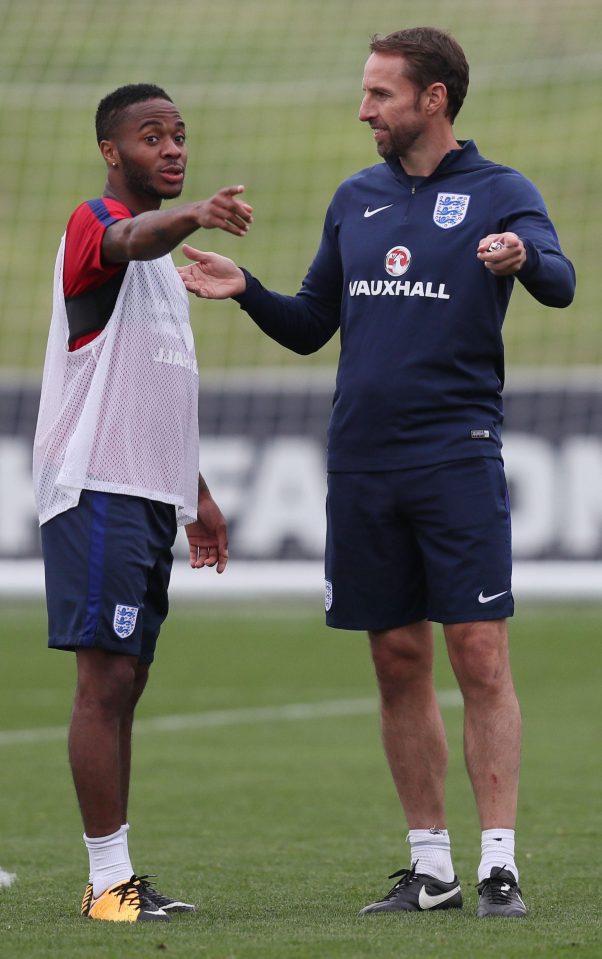  Raheem Sterling gets instructions from England boss Gareth Southgate