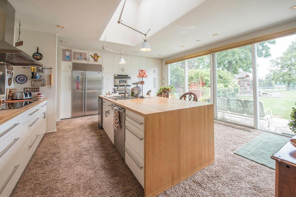  The kitchen includes a new centre island, cabinets and appliances