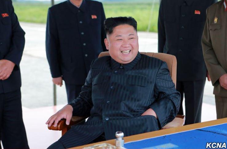  Keep 'em coming ...Kim Jong-un jubilant at yesterday’s missile launch which he 'guided'