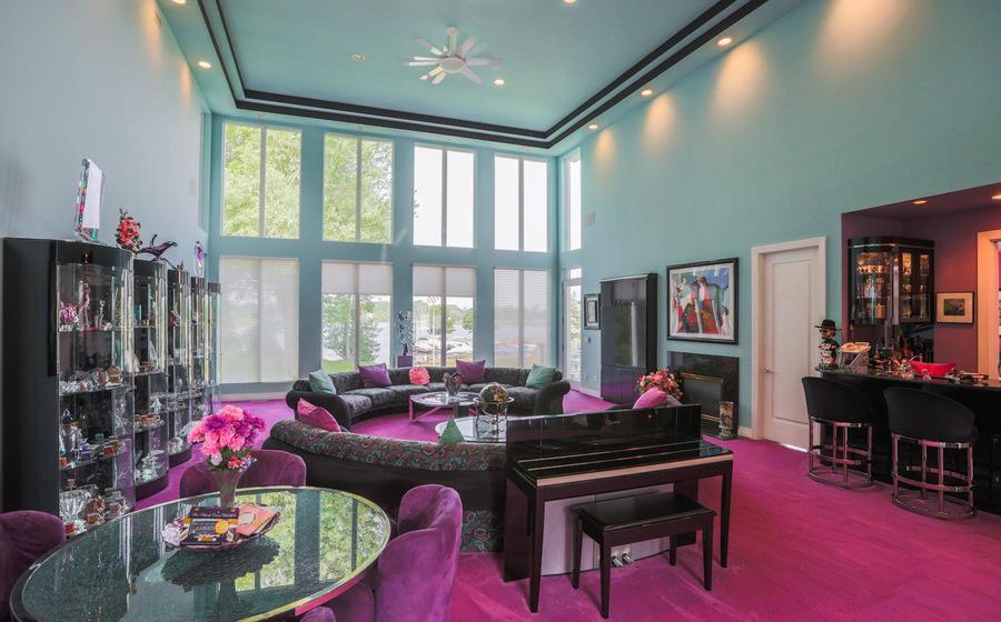 Another view of the living room reveals gorgeous floor to ceiling windows 