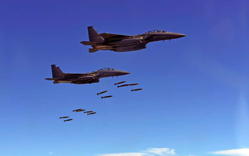 South Korea F-15K planes drop MK-82 bombs at a simulated target at the Pilseung Range in Gangwon