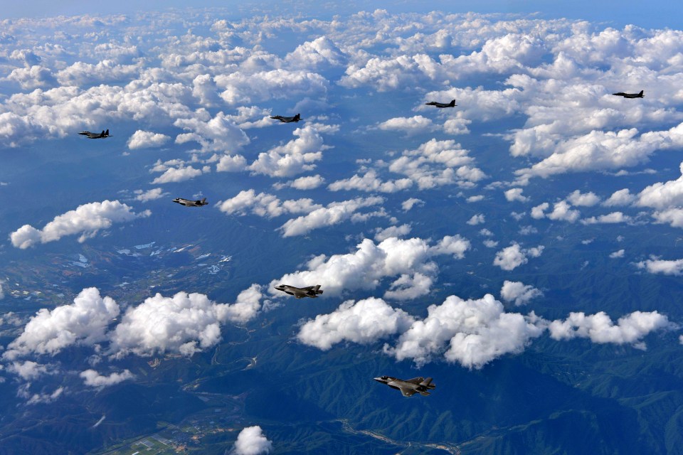 US Marine Corps F-35B fighter jets (front) and South Korean air Force’s F-15K fly over South Korea