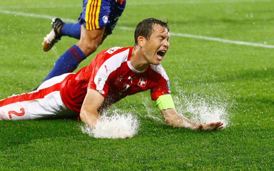  Switzerland's Stephan Lichtsteiner was a casualty of the waterlogged pitch