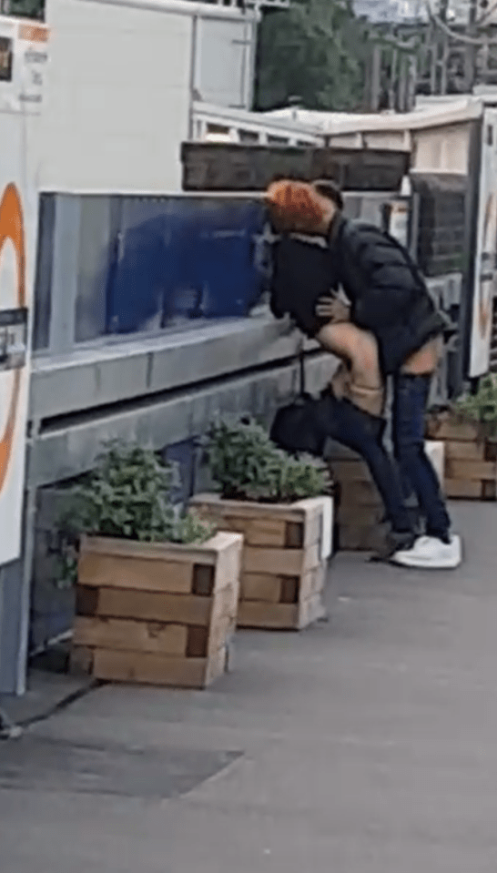  The randy couple were filmed romping at Hackney Downs station in East London