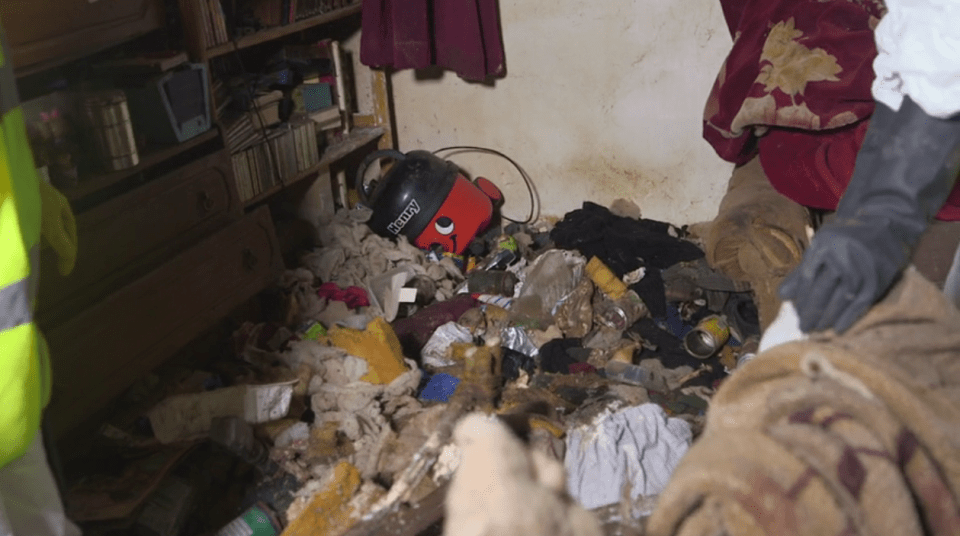  The living room, where the woman sleeps, was filled with food waste and every surface was mouldy